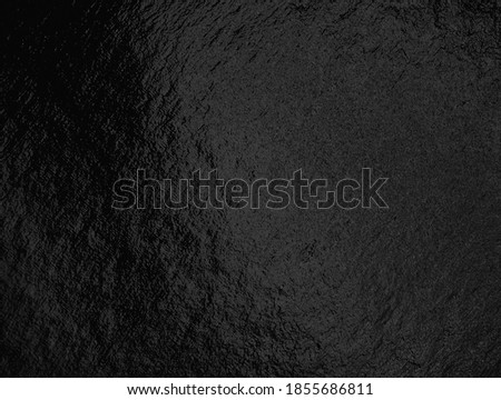 Black foil background with highlights and uneven texture Royalty-Free Stock Photo #1855686811