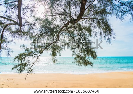 Beautiful tropical beach sea ocean with white cloud and blue sky for nature background