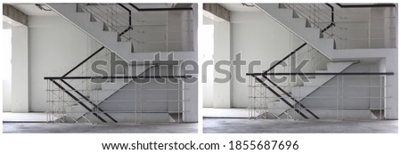 Concrete stairs are wooden handrails. Ladder in the building. Empty modern building stairway.