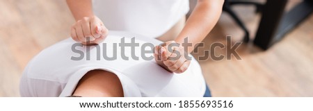 Cropped view of masseuse doing massage of client back on blurred background, banner