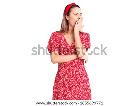 Young beautiful girl wearing dress and diadem bored yawning tired covering mouth with hand. restless and sleepiness. 