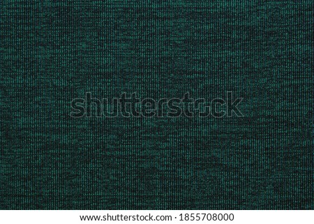 Dark green melange heather fabric texture as background