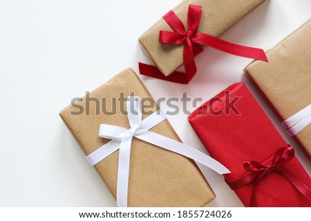 Holiday Gifts Arranged on White. Gift Boxes with Ribbon Bows.