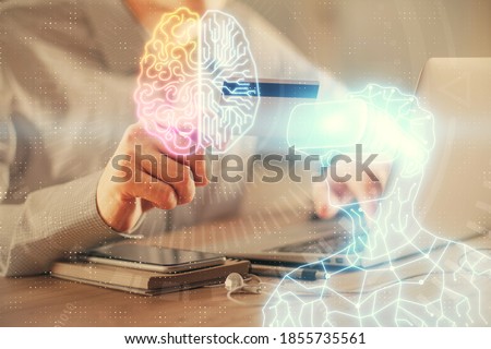 Double exposure of man hands holding a credit card and human in vr glasses drawing. Virtual reality and E-commerce concept.