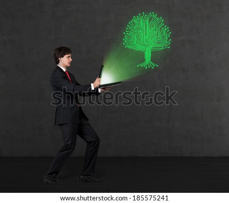 Businessman and a tree green projection