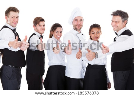 Waiters and waitresses showing thumbs up sign. Isolated on white background