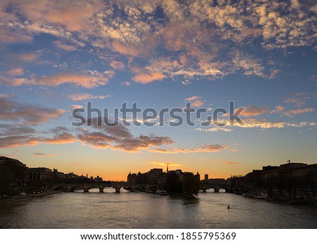 Paris sunrise over the Ile de la Cite and the Seine River Banks (UNESCO World Heritage Site) with Pont Neuf. 1st and 6th Arrondissements of Paris, France 