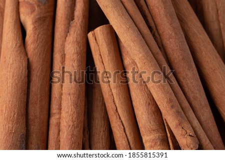 A pile of cinnamon on a white background