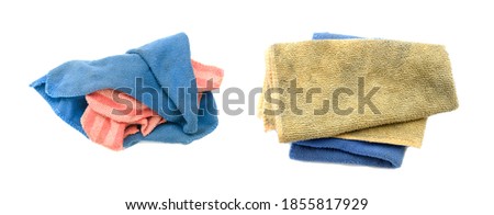 Old dirty torn rag isolated on white background. Cleaning rag. Royalty-Free Stock Photo #1855817929