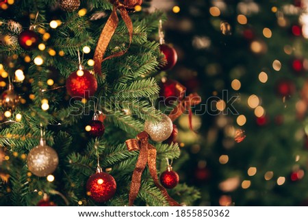 Beautiful and decorated Christmas tree. New Year mood. Great photo for greeting cards.