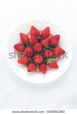 Strawberry in plate on white background. Strawberries top view. 
