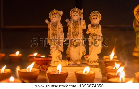 Lord Ram  idol brightening with Diya candle light on the occasion of Diwali. Diwali is the major festival of lights in India. Royalty-Free Stock Photo #1855874350
