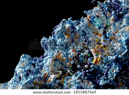 3d render of abstract art with surreal growing explosion wavy smoke cloud splash fluid based on small white and blue foam balls bubbles particles in movement on isolated black background