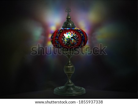 Traditional handmade mosaic lamp and reflection light on background , middle-eastren arabic ottoman light