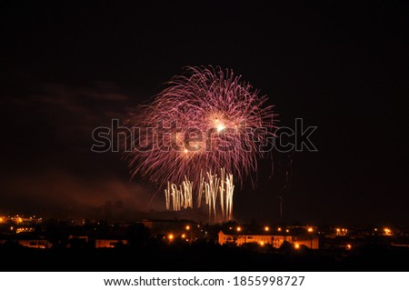 day of celebration with big fireworks of all colors and explosive colorful final bouquet