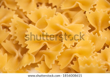 some farfalle pasta forming a background pattern.