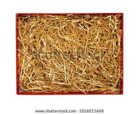  Golden shredded paper for gifting and stuffing in cardboard box. Top view, clipping path included Royalty-Free Stock Photo #1856015668