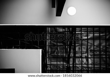 The geometric architecture of the ceiling of a modern building. Black and white photo