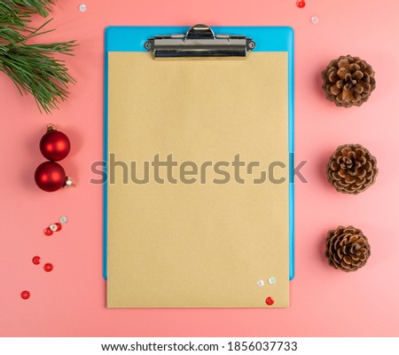 Christmas Decorations Mockup with Blank Sheet Top View. Red Xmas Background with Copy Space
