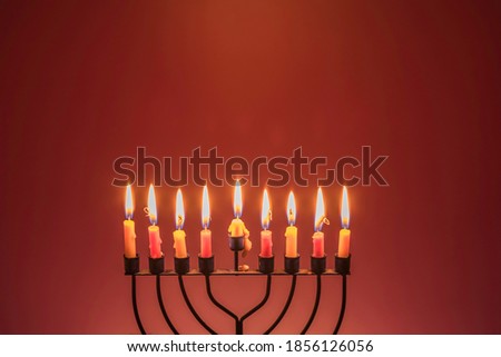 Jewish holiday Hanukkah background. Burning Hanukkah candles.