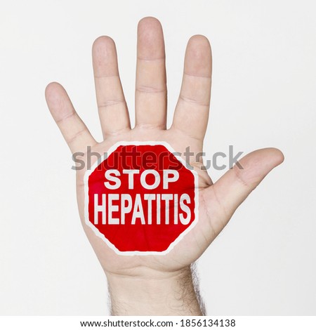 Medicine concept. On the palm of the hand there is a stop sign with the inscription - STOP HEPATITIS. Isolated on white background.