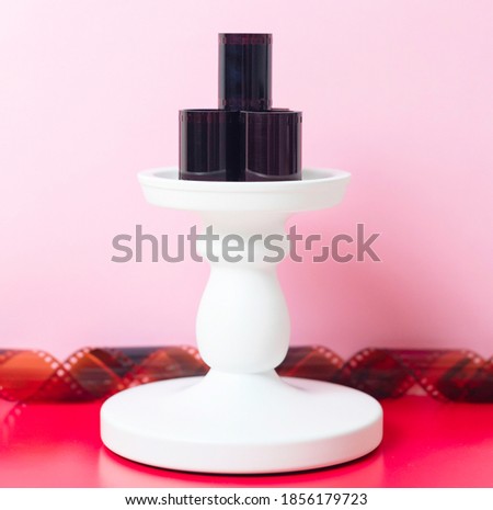 Film for photos on a pedestal on a colored background