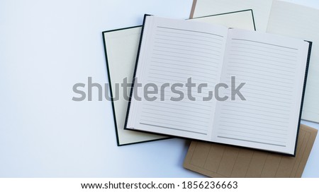 Notebooks on white background. Top view