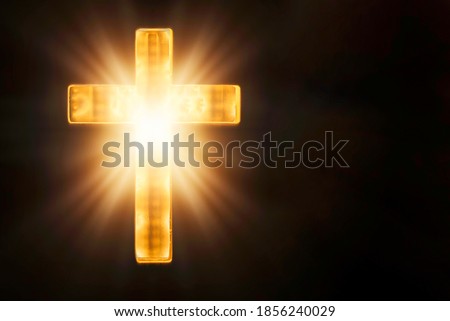 Christian cross with lights, bokeh on black background. Copy space. Faith symbol. Church worship, salvation concept. Faith symbol in Jesus Christ. Holy cross for Christmas, Easter day. Christianity.