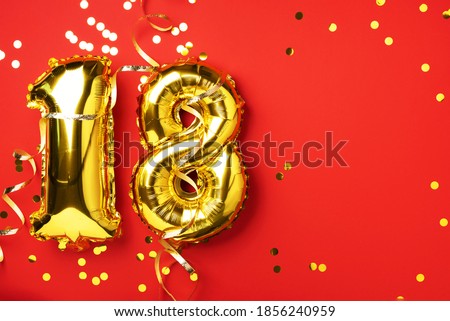 Gold foil balloon number, digit eighteen. Birthday greeting card, inscription 18. Anniversary celebration event. Banner. Stylish golden numeral, bright shiny glitter, red background. Numerical digit.