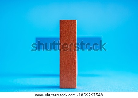 Blue wooden blocks on a blue background. Abstract background.