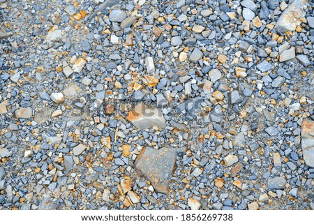  Background of pretty pebbles stone on the beach .
