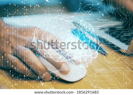 Hands using computer mouse with digital polygonal brain interface. Artificial intelligence and technology concept. Double exposure