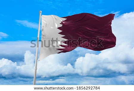 Large Qatar flag waving in the wind