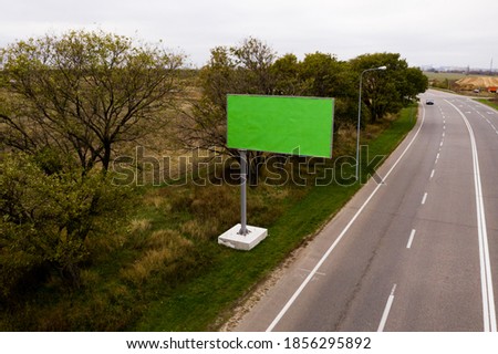 Big tall billboard on the road
