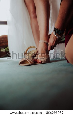 the bride's shoes are dressed