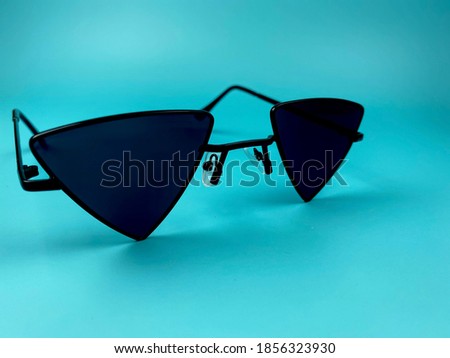 Three-shaped black glasses Polygonal with blue background