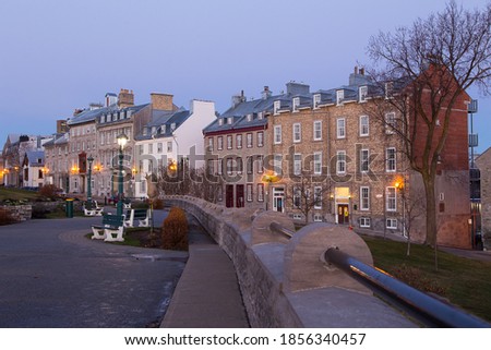 Blue hour view of row of mid-19th Century houses on St. Denis Avenue seen from the Pierre-Dugua-de-Mons terrace, Quebec City, Quebec, Canada