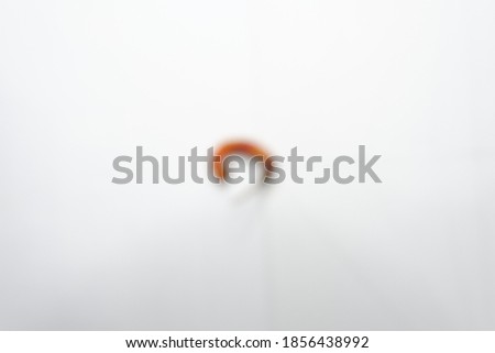Red Chili Pepper on a white background. Blur picture camera