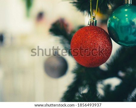 Close up of balls on christmas tree. Blurred background. Christmas and New year holiday concept.