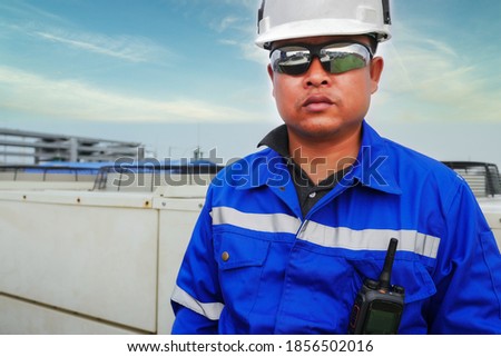 Portrait of engineer wear white safety helmet at outdoor construction site 