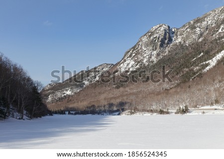 New Hampshire mountains - Cannon and Lafayette, Franconia Notch State Park. Snowy hills and rocks.