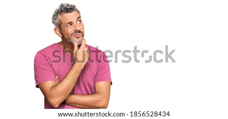 Middle age grey-haired man wearing casual clothes thinking worried about a question, concerned and nervous with hand on chin  Royalty-Free Stock Photo #1856528434