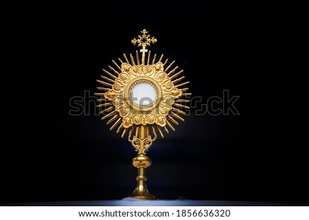 Ostensory for worship at a Catholic church ceremony - Adoration to the Blessed Sacrament - Catholic Church - Eucharistic Holy Hour Royalty-Free Stock Photo #1856636320