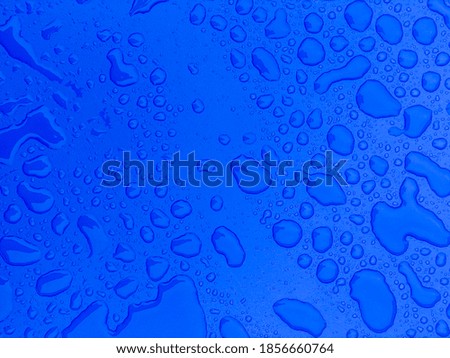 water drops on blue plastic background image