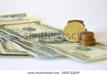  the pen lies on a white background and money. tuition fee. financing. High quality photo