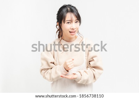A young woman with a convincing gesture shot in the studio
