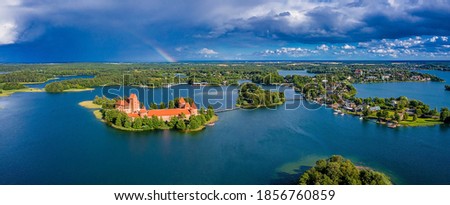 Aerial view of Trakai, over medieval gothic Island castle in Galve lake. Flat lay of the most beautiful Lithuanian landmark. Trakai Island Castle, most popular tourist destination in Lithuania Royalty-Free Stock Photo #1856760859