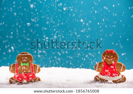 Christmas Feestive Greeting Card. Gingerbread Man and Woman. Copy Space Xmas Background.