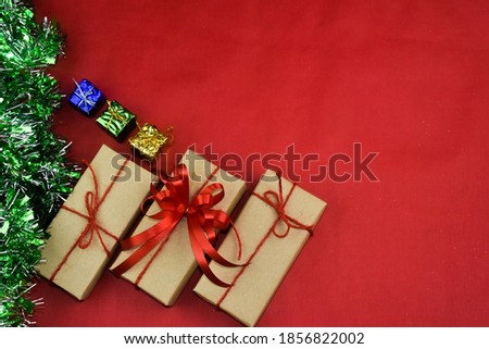 Gift box on red background for Merry Christmas, Brown gift box for happy new year