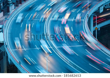 closeup of the curve lanes with car motion blur